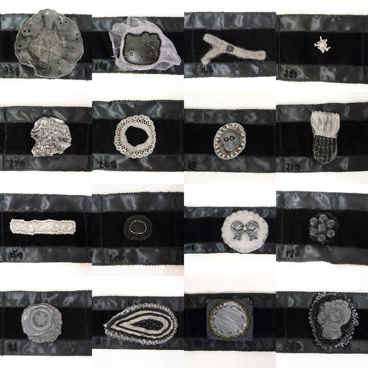 Contemporary mounring broaches attached to a black velvet ribbon.
